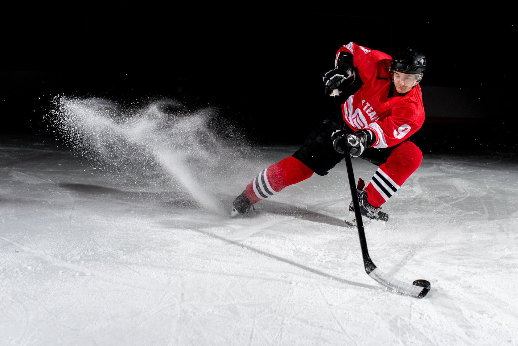 Man playing ice hockey